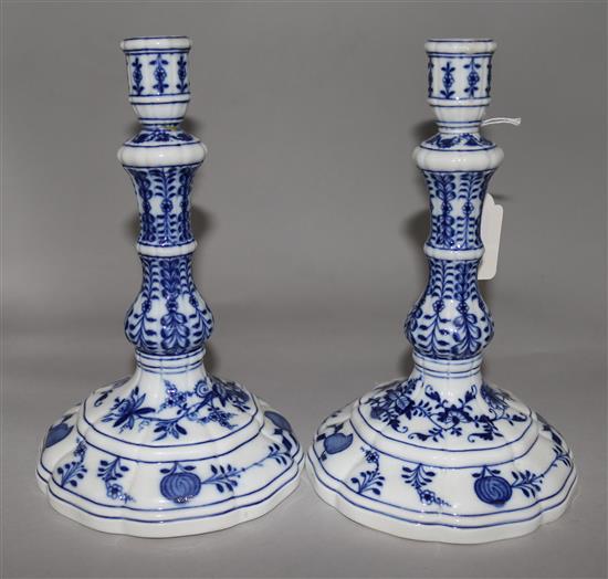 A pair of Meissen onion pattern blue and white candlesticks